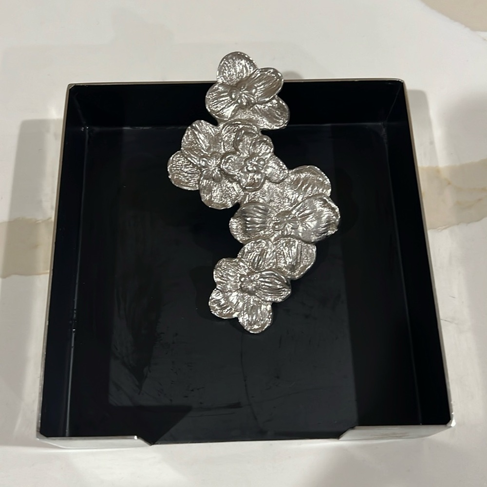 Michael Aram napkin holder - white orchid. Retails for $75 plus tax